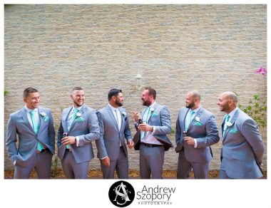 formal portrait photo of groom and groomsmen outside