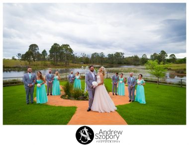 Large bridal party photo group laughing and being playful