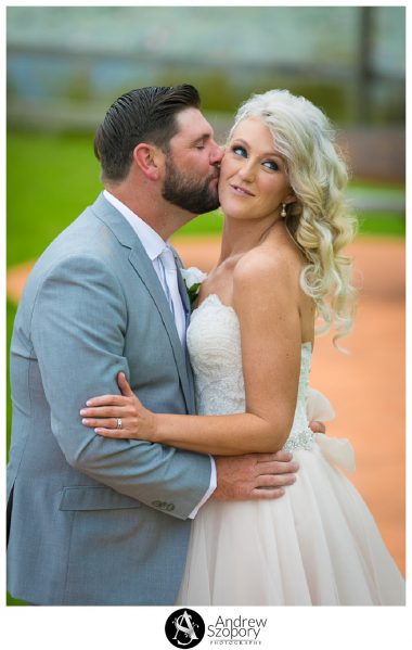 Bride and groom laughing as they interact