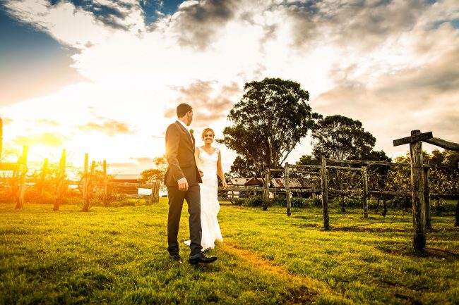 Bride-and-groom-walk-through-the-vineyards-at-Belgenny-farm-08